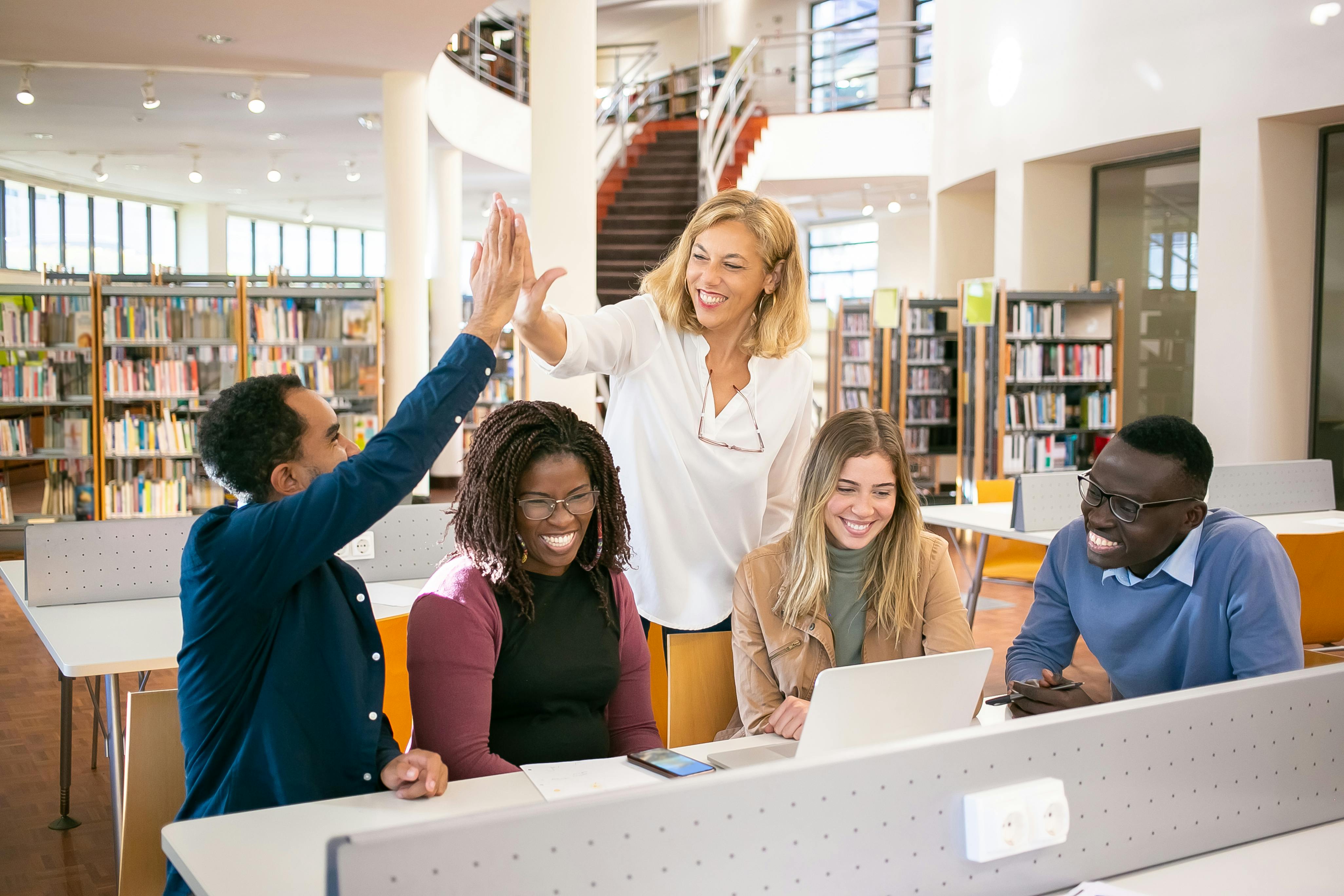 A groups of students studying in the library