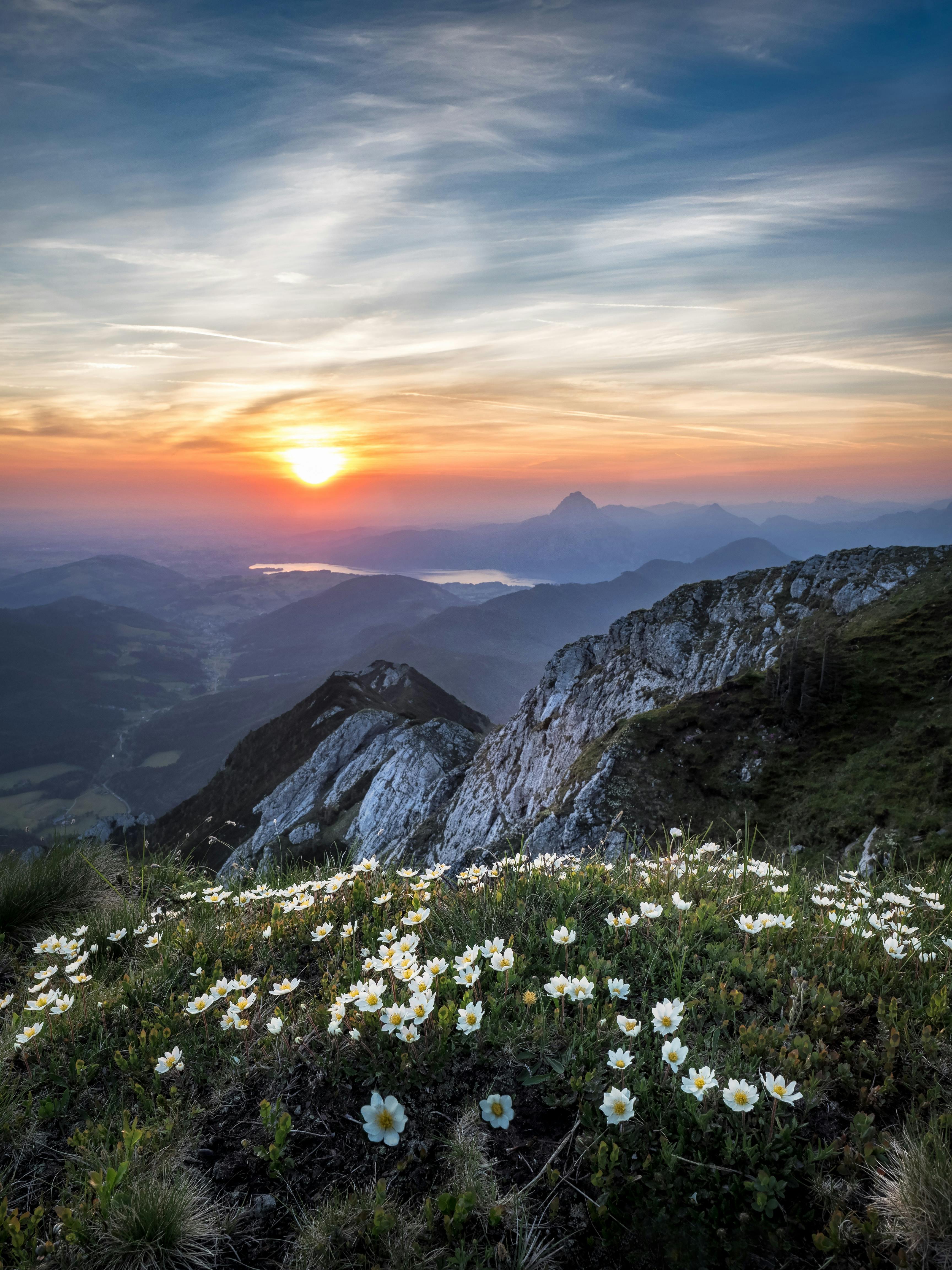 The sunsetting over a mountain range
