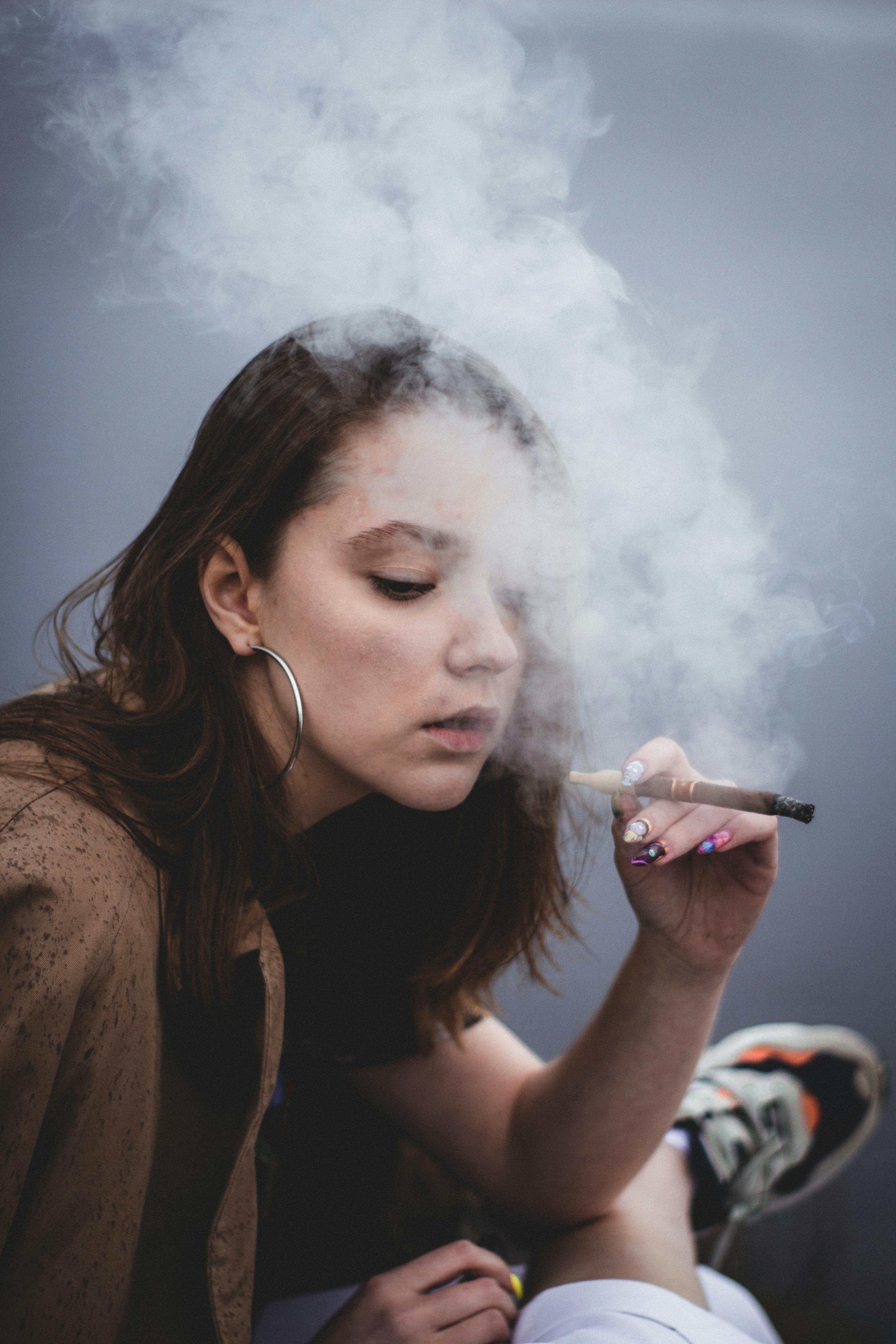 A teenaged girl smoking.